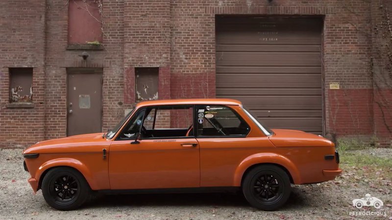 Petrolicious carves up the road with a pumpkin-colored BMW 2002